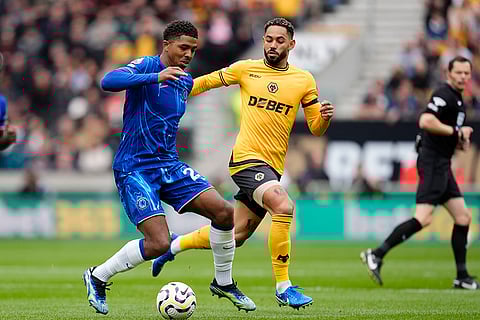 Premier League 2024-25: Chelsea's Wesley Fofana, left, and Wolverhampton Wanderers' Matheus Cunha battle for the ball